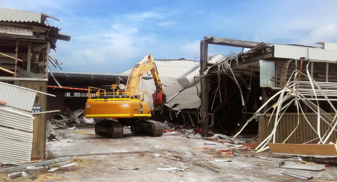 yellow crane demolition site